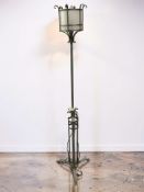 A 20th century wrought metal standard lamp.
