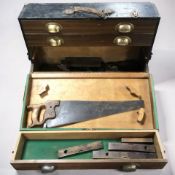 A joiner's toolbox containing assorted planes and other tools.