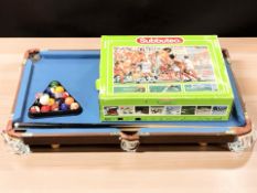 A Subbuteo game and a table top pool table.