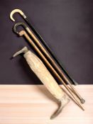 Two horn handled walking sticks with silver mounts,