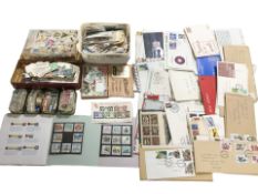 A very large quantity of mostly loose stamps including some mint examples, various first day covers,