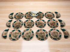 A collection of Czechoslovakian gilt porcelain dishes and a sauceboat decorated with fish.