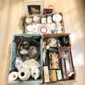 A collection of porcelain mugs, glass wares, wall clock, vintage camera, tins, cutlery, etc.