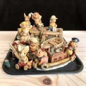 A collection of Pendelfin rabbits.