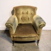 A Victorian armchair in deep buttoned olive draylon, width 83 cm.