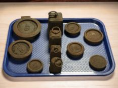 A group of cast iron graduated weights.