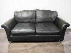 A modern Parker Knoll black leather three seater settee, length 197 cm.