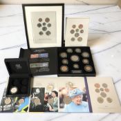 A collection of coin issues including a Queen Elizabeth II 1953 coronation coin and stamp set,