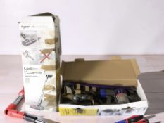 Two Dyson vacuums in boxes.