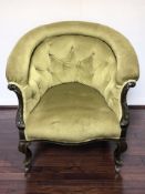 A Victorian mahogany framed horseshoe shaped armchair in deep buttoned green upholstery,