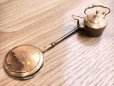 A Victorian copper kettle and a bed warming pan.
