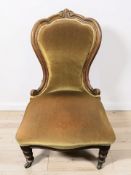 A Victorian walnut lady's chair.