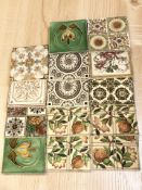 A collection of late Victorian Art Nouveau earthenware tiles, width 15 cm.
