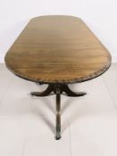 A reproduction inlaid mahogany twin pedestal dining table, extended 243 cm x 100 cm x 75 cm.