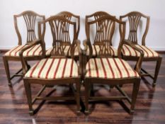 A set of six reproduction mahogany shield back dining chairs.