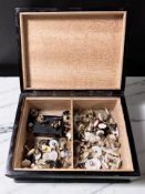 A lacquered trinket box containing assorted mother of pearl and other dress studs and cufflinks.