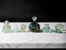 A Victorian Sunderland green glass dump paperweight with bubble inclusions, height 9.