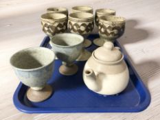 A set of six stoneware goblets, a further pair of goblets and a teapot.