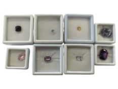 A group of loose gem stones including 0.51 carat yellow sapphire, 0.