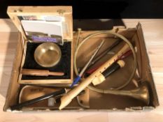 A group of musical instruments, recorders, French horn, etc.
