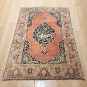 An antique Kirman rug, South-East Iran, circa 1900, 203 cm x 143 cm.