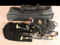 A set of Widdicombe Northumbrian pipes, with bellows and carry bag.