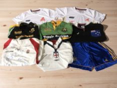 A group of rugby shirts including an England shirt with various signatures.