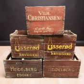 A group of vintage painted pine bottle crates with advertising, largest 56 cm wide.