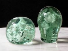 Two Victorian Sunderland green glass dumps with flower sulphide inclusions, tallest 10.5 cm.