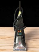 A Bissell carpet washer.