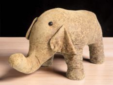A large liberty style footstool figure of an elephant, length 86 cm.