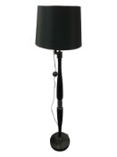A contemporary ebonised standard lamp, height 163 cm.