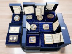 A collection of Halcyon Days enameled trinket boxes, all cased with certificates.