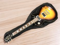 An Epiphone Les Paul Standard model electric guitar, together with a carry bag.