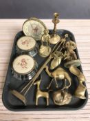 A group of brass animal ornaments, candlestick, dressing table items, etc.
