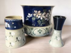 A Langley Ware pottery planter, height 20 cm, together with a similar jug and vase.
