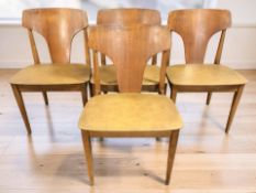 A set of four mid-century Elliotts of Newbury bent and laminated teak dining chairs.