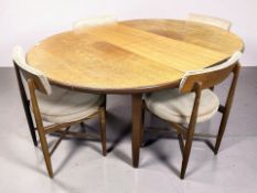 A 20th century G-Plan teak oval extending dining table, 163 cm x 124 cm x 72 cm (extended),