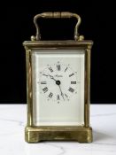 A gilt brass carriage clock signed 'Angelus, made in England',