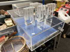 A group of contemporary perspex display boxes / stands.