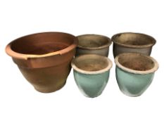 Five various garden earthenware planters, largest 54 cm diameter.