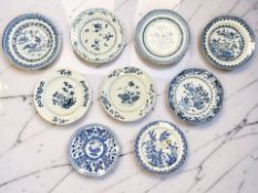 Nine Chinese blue and white porcelain plates and shallow bowls, largest diameter 23.