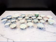 Approximately twenty four Chinese porcelain tea bowls including famille rose,