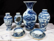 A Chinese blue and white porcelain baluster vase decorated with birds in flight above a landscape,