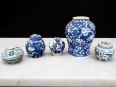 A Chinese blue and white porcelain temple jar decorated with prunus blossom on cracked ice ground,