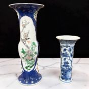 A Chinese porcelain beaker vase, Kangxi reign mark but not of the period,