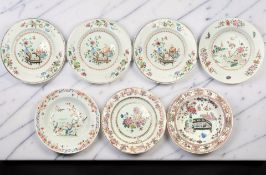 A set of three Chinese famille rose porcelain plates all depicting a black and gilt lacquered