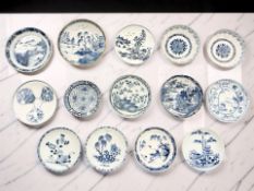 Fourteen Chinese blue and white porcelain saucers and shallow bowls, 18th / 19th century,
