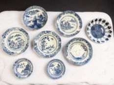 Eight various Chinese blue and white porcelain plates and shallow bowls, Qianlong, 18th century,
