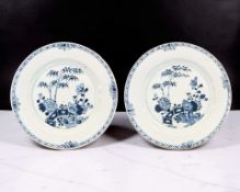 A pair of Chinese blue and white porcelain plates decorated with stalks of bamboo and flower